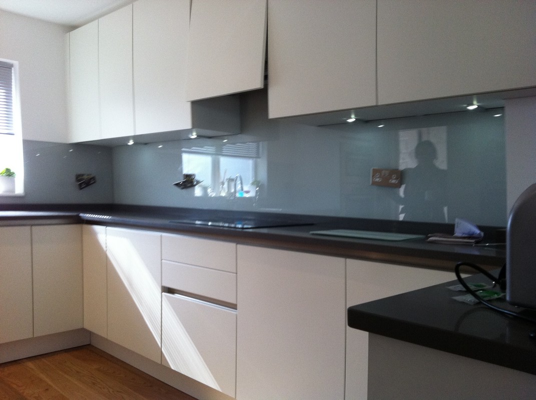 Grey glass kitchen splashback with LED lighting in Acton
