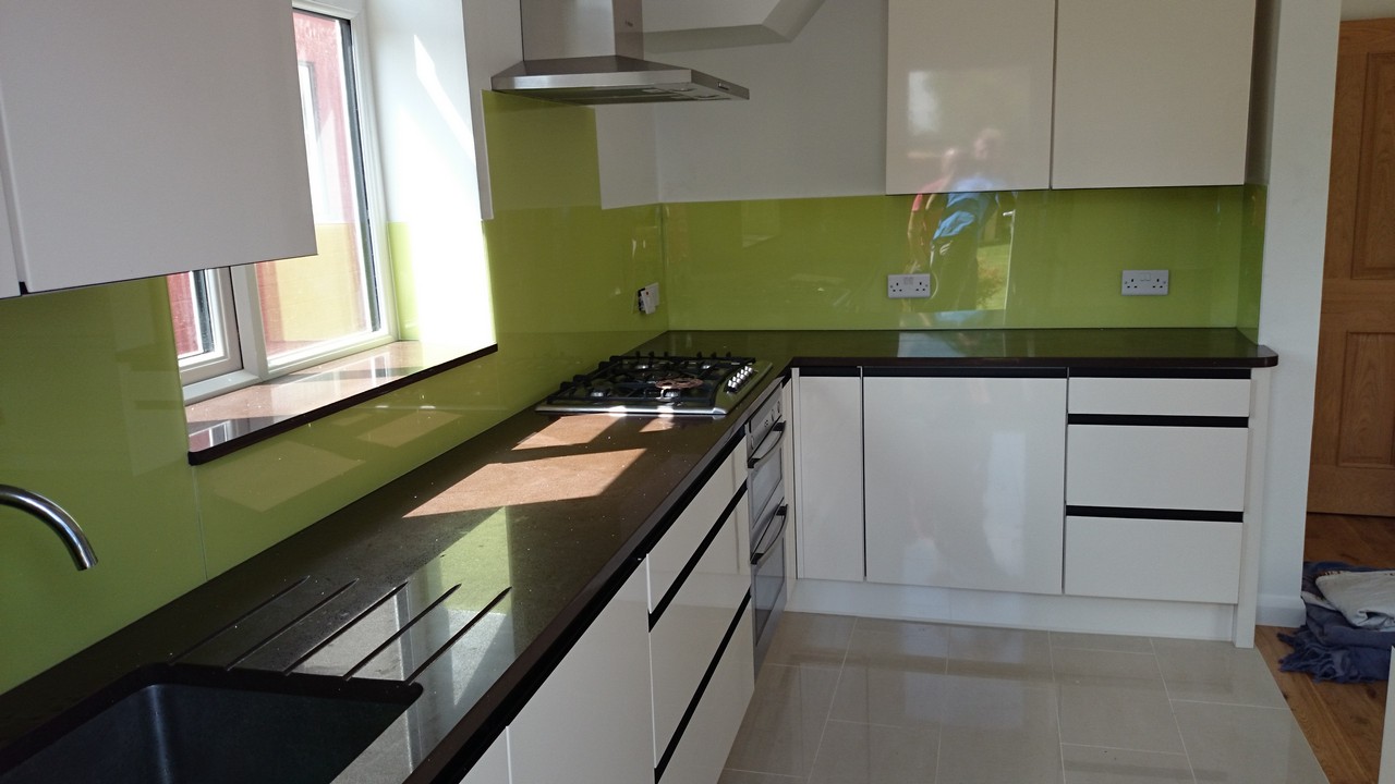 Lime green glass kitchen splashback installed by Acton glaziers